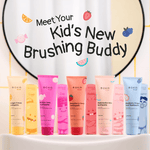 Row of various Boka Kids toothpaste tubes including the pink Bubble Gum flavor displayed beneath a mirror with text meet your kid's new brushing buddy.