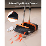 Broom sweeping debris into a dustpan with rubber edge close-up and inset showing dustpan lip, on tiled floor with orange directional arrows.