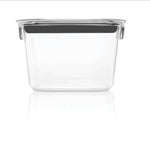 Clear Rubbermaid Brilliance rectangular container with gray clip shown from the side on a white reflective surface.