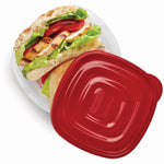 Rubbermaid TakeAlongs clear container holding a sandwich with a red lid placed beside it on white background