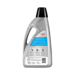 Rear view of a silver Rug Doctor carpet cleaner bottle showing product instructions and barcode on white background