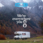 Scenic outdoor shot with an RV parked in front of forested mountains and WALEX logo plus tagline 'We're everywhere you go'