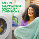 Smiling person holding a towel beside a front-load washer with a Gain Relax bottle visible in the background and text about machine safety