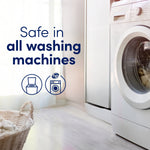 Laundry room scene with washing machine, basket and text 'Safe in all washing machines' with icons