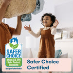 Smiling child reaching up in a home scene with Safer Choice certified badge and ECOS branding overlay