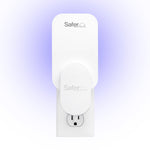 Safer Home refill card installed on an indoor plug-in trap with a soft purple glow behind it