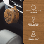 Close-up of amber leather Scent Theory vent diffuser clipped to a car vent with feature icons