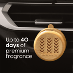 Close-up of woodgrain Scent Theory diffuser clipped to a car vent with text claiming up to 40 days of premium fragrance