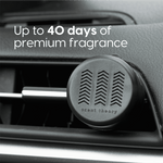 Black Scent Theory vent diffuser attached to a car vent with text claiming up to 40 days of premium fragrance.