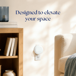 Plug-in diffuser mounted in a living room scene with text 'Designed to elevate your space' promoting Scent Theory diffuser