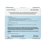 Back of the Scent Theory sea salt linens refill package showing usage instructions, caution text, ingredients, and brand label