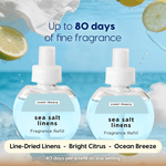 Two round refill bottles labeled sea salt linens against a watery beach background with claim up to 80 days of fragrance