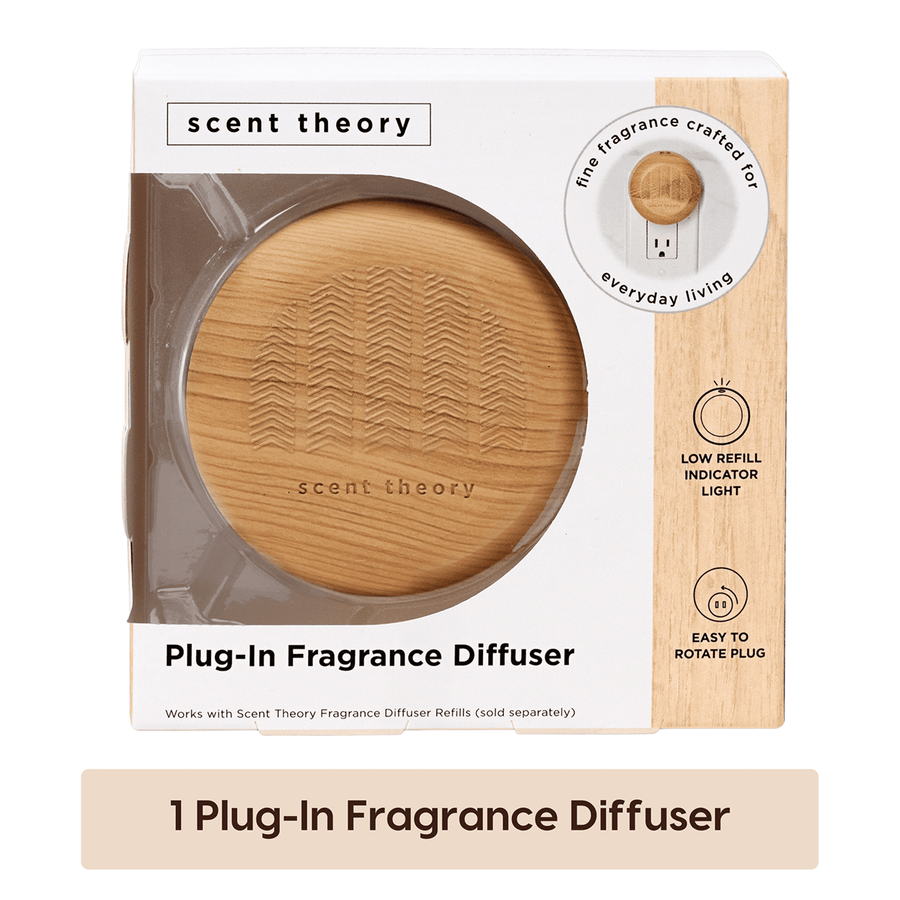 Packaged Scent Theory plug-in fragrance diffuser with wood finish visible through round window on white retail box