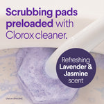 Close-up of a purple hexagonal scrubbing pad attached to a wand cleaning a toilet bowl with text about preloaded Clorox cleaner.
