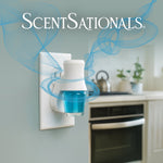 ScentSationals plug-in warmer shown in a kitchen outlet with blue fragrance cup and swirling scent graphics