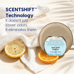 Sea salt linens refill placed in a plug-in diffuser on a towel with citrus slices and text about SCENTSHIFT technology