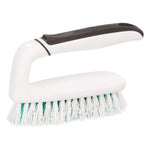 Angled studio photo of a white Scotch-Brite scrub brush with gray handle and dense cleaning bristles