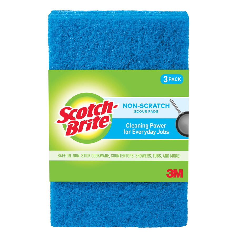 Packaged Scotch-Brite blue non-scratch scour pad with green branded sleeve and 3M logo on white background.