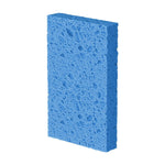 Single blue Scotch-Brite sponge photographed on white background showing porous texture and rectangular shape