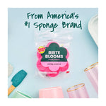 Packaged pink Scotch-Brite Brite Blooms flower sponge on a pastel background with branded headline