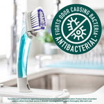 Dishwand standing on a sink with an antibacterial badge reading 'fights odor causing bacteria'