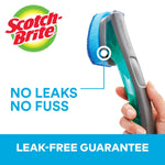 Close-up of a Scotch-Brite dishwand handle showing refill attachment with ‘no leaks no fuss’ graphic and brand logo.