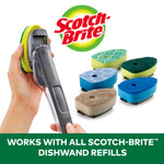 Hand holding a Scotch-Brite dishwand next to several replacement refill sponges, brand logo above