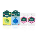 Two Dobie scrub pad boxes and two pink Scotch-Brite Brite Blooms flower-shaped sponges on white