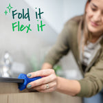 Close-up of a hand flexing a blue sponge to clean a tight edge with text ‘Fold it Flex it’