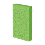 Single green Scotch-Brite multi-purpose sponge photographed upright on white background highlighting porous surface