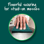 Close-up circular photo of a hand scrubbing a metal surface with a dark‑green Scotch‑Brite scour pad and headline about powerful scouring.