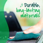 Hand holding a dark‑green Scotch‑Brite scour pad wiping a grill surface with overlaid text "Durable, long‑lasting materials."