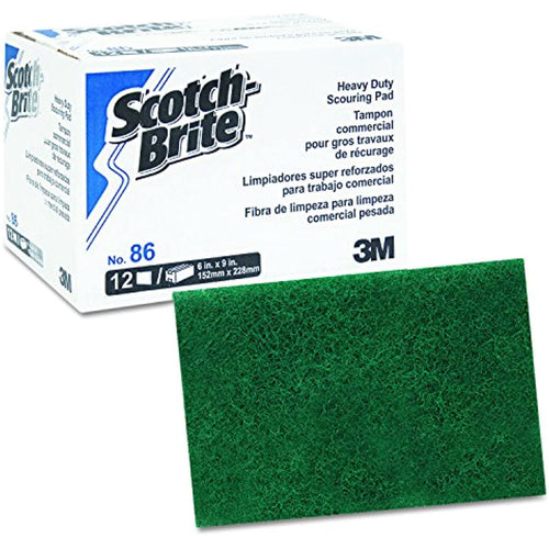 Scotch-Brite branded box next to a green scouring pad showing product packaging and pad detail