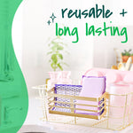 Lifestyle image of purple Scotch-Brite pads drying in a golden dish rack with text 'reusable + long lasting' above.