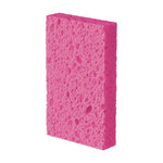 Single pink Scotch-Brite sponge shown upright against a white background emphasizing textured porous surface