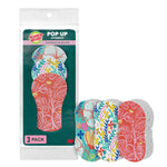 Single sealed pouch of Scotch-Brite Pop Up sponges shown with three floral-patterned sponges next to it.