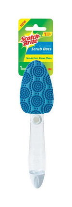 Close-up of Scotch-Brite Scrub Dots dishwand showing blue patterned scrub head and clear handle against branded green-yellow card.