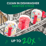 Three floral pop-up sponges placed in a dishwasher rack, with text about cleaning in dishwasher sanitize cycle.