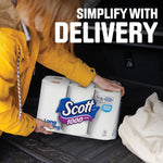 Lifestyle image of a person placing a Scott 1000 pack into a vehicle trunk with large ‘Simplify with Delivery’ text