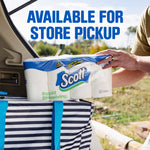 Person placing a Scott Rapid Dissolving toilet paper pack into a striped tote from a vehicle trunk with store pickup text