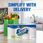 Scott rapid-dissolving toilet paper pack on a kitchen island beside a green reusable grocery bag and produce