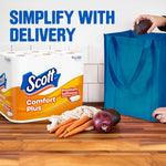 Scott Comfort Plus pack on a kitchen counter next to vegetables and a reusable bag with 'Simplify with Delivery' text.