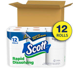 Open cardboard box behind a 12-roll Scott Rapid Dissolving toilet paper pack with visible branding