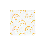 Square swatch of white fabric covered in orange Scrub Daddy smiley-face pattern on a white background.