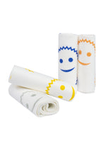 Four rolled and folded Scrub Daddy streakless cloths displayed on white background showing smiley-face prints.