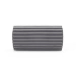 Gray cylindrical ribbed foam sponge laying horizontally on a white background.