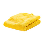 Folded bright yellow Scrub Daddy microfiber cloth on white background showing soft pile