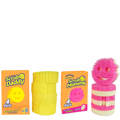 Two orange Scrub Daddy and Scrub Mommy boxes with stacks of yellow and pink smiling scrub sponges on white background
