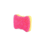 Three-quarter view of yellow contoured sponge showing pink textured scrubber side against white