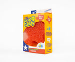 Front view of Scrub Daddy special edition yellow box showcasing the orange Texas-shaped FlexTexture scrubber